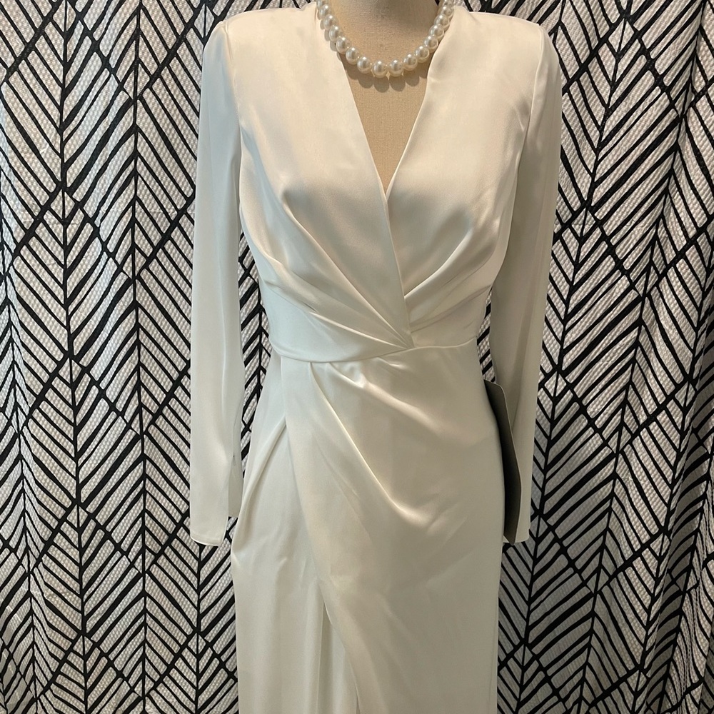 Satin bridal dress. With tags. Long sleeves
